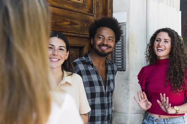 Smiling colleagues looking at businesswoman model released, Symbolfoto property released, PNAF04477