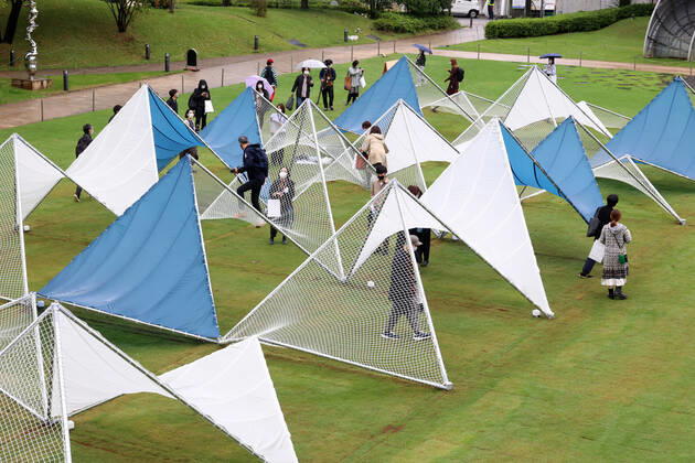October 14, 2022, Tokyo, Japan - A large installation Sea Hammock formed by tarps and fishnets created by Japanese architect Yuko Nagayama is displayed on the lawn field as a part of the Tokyo Midtown Design Touch 2022 in Tokyo on Friday, October 14, 2022. An annual design event with the theme of Design for Sustainable Future started at the Tokyo Midtown through November 3. , aflo_201255364.jpg,