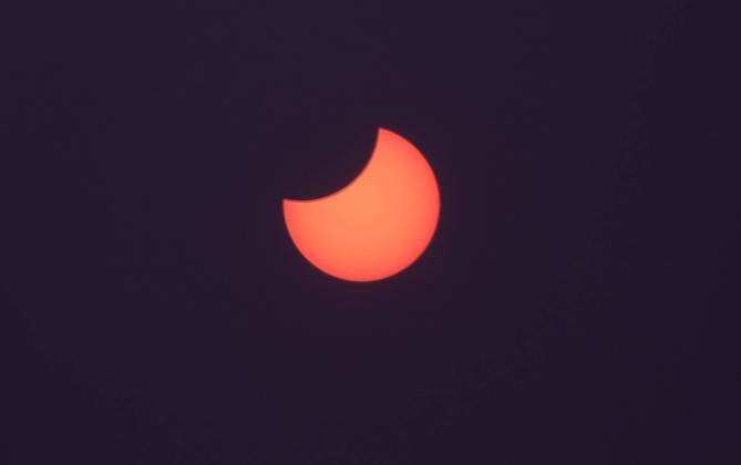 Picture shows a view of the moon partially obscuring the sun disk, This picture taken on October 25, 2022 shows a view of the moon partially obscuring the sun disk, seen behind an X-ray image as a filter, during a partial solar eclipse visible from Gaza City in the Palestinian Gaza Strip enclave. Photo by Ashraf Amra apaimages Gaza city Gaza Strip Palestinian Territory 251022_Gaza_ASH_3_00 (11) Copyright: xapaimagesxAshrafxAmrax xapaimagesx