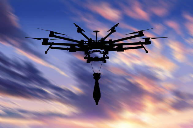Ukraine: Military drone with bomb and rocket Military drone with a bomb at sunset. Combat drone in military conflicts . Illustrative photo Ukraine Copyright: AleksandrxGusev