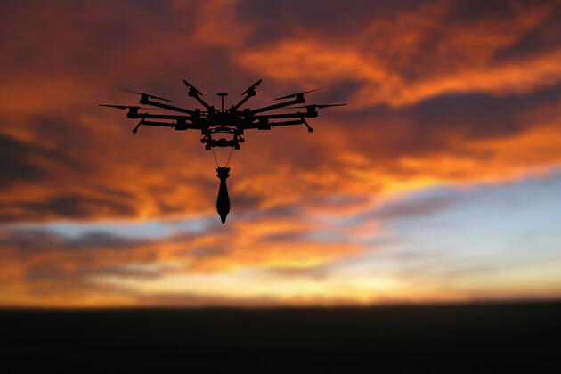 Ukraine: Military drone with bomb and rocket Military drone with a bomb at sunset. Combat drone in military conflicts . Illustrative photo Ukraine Copyright: AleksandrxGusev