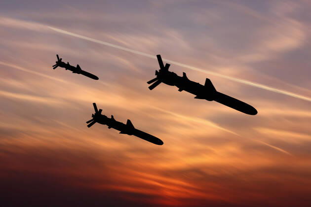 Ukraine: Military drone with bomb and rocket Cruise missiles against the western sky. Illustrative photo Ukraine Copyright: AleksandrxGusev