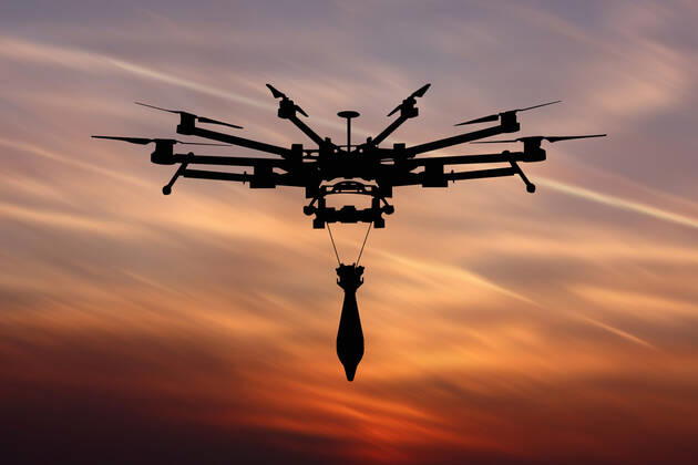 Ukraine: Military drone with bomb and rocket Military drone with a bomb at sunset. Combat drone in military conflicts . Illustrative photo Ukraine Copyright: AleksandrxGusev