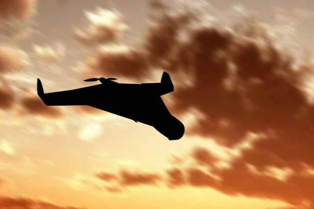 Ukraine: Military drone with bomb and rocket Silhouette of an Iranian military unmanned aerial vehicle at sunset. Combat drone. Illustrative photo Ukraine Copyright: AleksandrxGusev