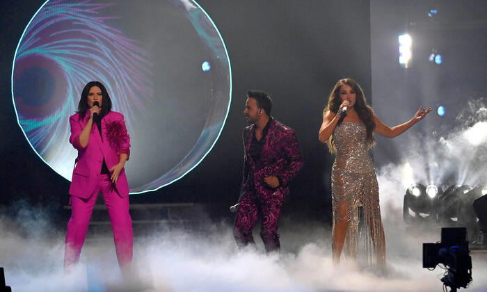 (L-R) Co-hosts Laura Pausini, Luis Fonsi and Thalía perform onstage during the 23rd annual Latin Grammy Awards at the Michelob Ultra Arena at Mandalay Bay Resort and Casino in Las Vegas, Nevada on Thursday, November 17, 2022.  LAV20221117615 JIMxRUYMEN