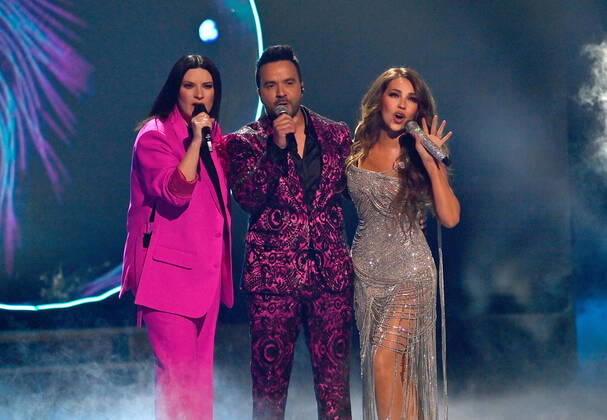 (L-R) Co-hosts Laura Pausini, Luis Fonsi and Thalía perform onstage during the 23rd annual Latin Grammy Awards at the Michelob Ultra Arena at Mandalay Bay Resort and Casino in Las Vegas, Nevada on Thursday, November 17, 2022.  LAV20221117617 JIMxRUYMEN
