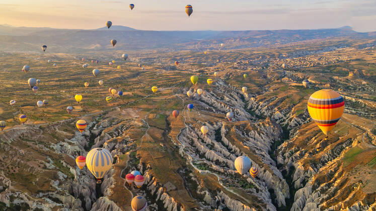 Turkey balloons Cappadocia Goreme Kapadokya , Sunrise in the mountains of Capadocia Sunrise with hot air balloons in Cappadocia, Turkey balloons in Cappadocia Goreme Kapadokya, and Sunrise in the mountains of Cappadocia with many hot air ballon in the sky Copyright: xZoonar.com FokkexBaarssenx 19156547