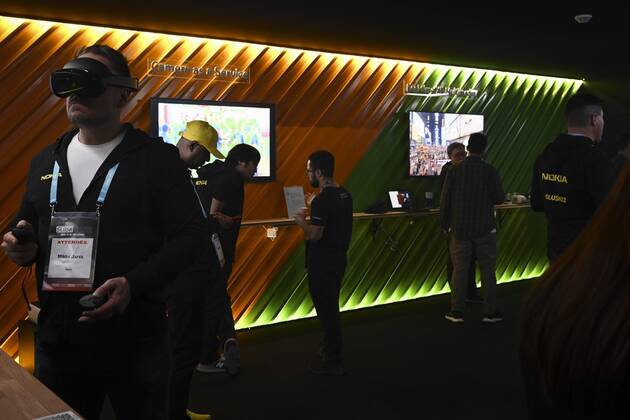 Attendees at the Nokia booth during the Slush 2022 Startup Event in Helsinki, Finland on November 18, 2022. Helsinki Finland  Copyright: xEmmixKorhonenx LKKTF20221118172948VTIR