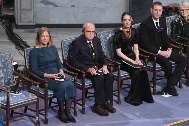 Belarusian Natallia Pinchuki (wife of 2022 Nobel Peace Prize winner - jailed Belarusian activist Ales Bialiatski), Russian Yan Rachinsky (chairman of the international Memorial Board), and Ukrainian Oleksandra Matviichuk (head of the Ukrainian Center for Civil Liberties) attend the 2022 Nobel Peace Prize award ceremony at the City Hall in Oslo, Norway on December 10, 2022.  LON20221210204 PAULxTREADWAY