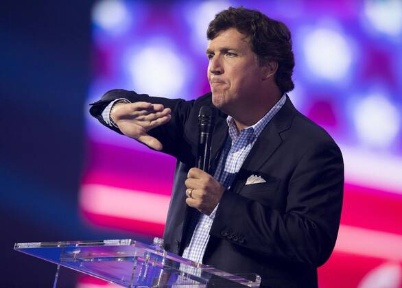 December 17, 2022 - Phoenix, Arizona, USA - Fox News host TUCKER CARLSON speaks at Turning Point USA s AmericaFest 2022. Phoenix USA - ZUMAce6_ 20221217_zaf_ce6_001 Copyright: xBrianxCahnx