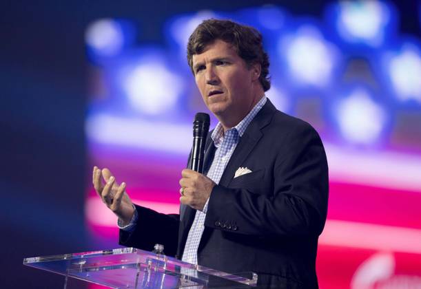 December 17, 2022 - Phoenix, Arizona, USA - Fox News host TUCKER CARLSON speaks at Turning Point USA s AmericaFest 2022. Phoenix USA - ZUMAce6_ 20221217_zaf_ce6_012 Copyright: xBrianxCahnx