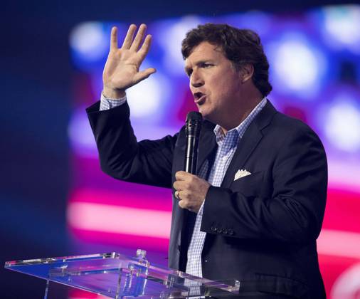 December 17, 2022 - Phoenix, Arizona, USA - Fox News host TUCKER CARLSON speaks at Turning Point USA s AmericaFest 2022. Phoenix USA - ZUMAce6_ 20221217_zaf_ce6_016 Copyright: xBrianxCahnx
