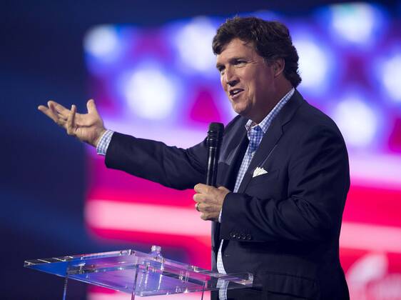 December 17, 2022 - Phoenix, Arizona, USA - Fox News host TUCKER CARLSON speaks at Turning Point USA s AmericaFest 2022. Phoenix USA - ZUMAce6_ 20221217_zaf_ce6_019 Copyright: xBrianxCahnx