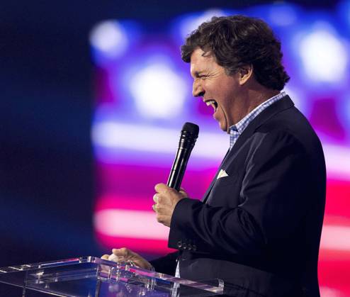 December 17, 2022 - Phoenix, Arizona, USA - Fox News host TUCKER CARLSON speaks at Turning Point USA s AmericaFest 2022. Phoenix USA - ZUMAce6_ 20221217_zaf_ce6_021 Copyright: xBrianxCahnx
