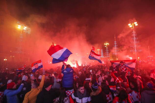 (221218) -- ZAGREB, Dec. 18, 2022 -- Croatian football fans celebrate at Ban Jelacic Square in Zagreb, Croatia, Dec. 17, 2022. Croatia beat Marocco and won the third place at the Qatar World Cup on Saturday. ( PIXSELL via Xinhua) (SP)CROATIA-ZAGREB-FOOTBALL-FIFA WORLD CUP-FANS SanjinxStrukic