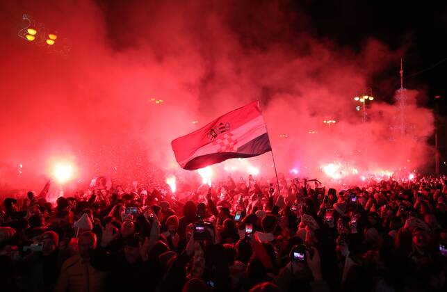 (221218) -- ZAGREB, Dec. 18, 2022 -- Croatian football fans celebrate at Ban Jelacic Square in Zagreb, Croatia, Dec. 17, 2022. Croatia beat Marocco and won the third place at the Qatar World Cup on Saturday. ( PIXSELL via Xinhua) (SP)CROATIA-ZAGREB-FOOTBALL-FIFA WORLD CUP-FANS SanjinxStrukic