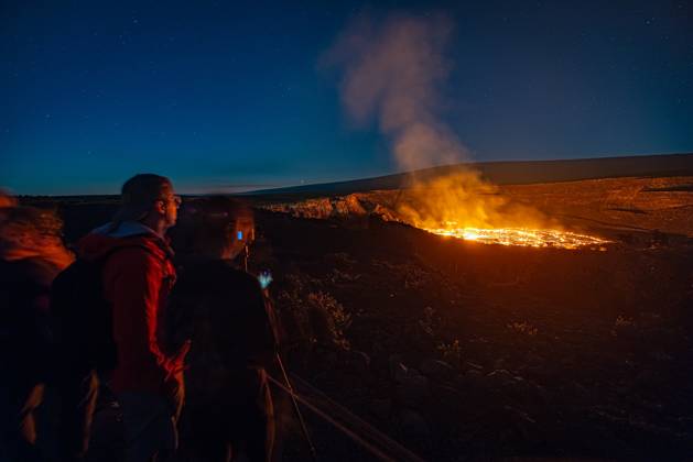 VOLCANO, HI - January 7, 2023: Spectators observe the eruption pictured as Hawaii?s Kilauea volcano eruption continued after re-erupting on January 5th in Volcano, HI on January 7, 2023. Copyright: xErikxKabikxPhotography xMediaPunchx