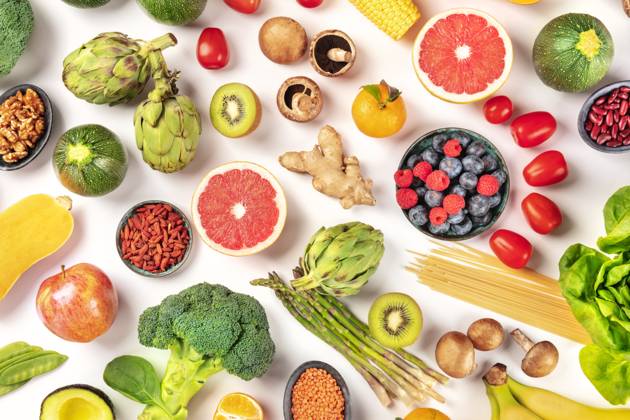 Vegan food. Healthy diet concept. Fruits, vegetables, pasta, nuts, legumes, mushrooms, shot from the top on a white background. A flat lay composition Vegan food. Healthy diet concept. Fruits, vegetables, pasta, nuts, legumes, mushrooms, shot from the top on a white background. A flat lay composition Copyright: xZoonar.com KaterinaxSolovyevax 14687794