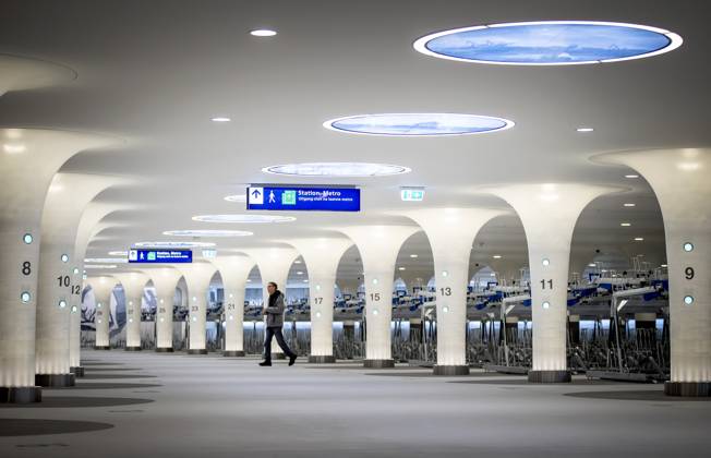 AMSTERDAM - The new bicycle parking at Amsterdam Central. The new Stationsplein parking facility has room for 7,000 bicycles. The bicycle shed was built under water and is connected underground to the metro and station hall. ANP KOEN VAN WEEL netherlands out - belgium out