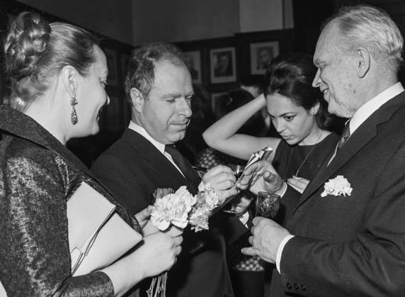 Moscow, USSR. April 2, 1964. Director of the Royal Shakespeare Theatre Peter Brook signs an autograph for Nikolay Kedrov, main director of the Gorky Moscow Art Theatre, (L-R) after the King Lear performance on stage of a branch office of the Gorky MAT. Natasha Parry, wife of P. Brook (C) attends the event. Alexander Konkov TASS  18068070