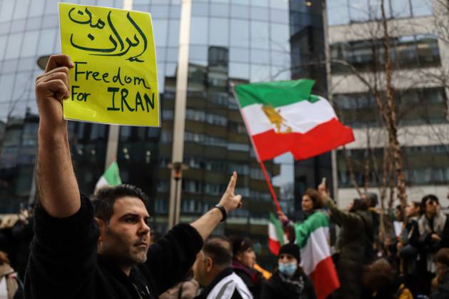 February 20, 2023, Brussels, Brussels Capital Region, Belgium: A demonstrator holds a sign reading Freedom for Iran during a protest in support of Iranian resistance movement on the sidelines of a meeting of foreign affairs ministers at the European Union headquarters in Brussels, Belgium, February 20, 2023. Brussels Belgium - ZUMAm177 20230220_zip_m177_013 Copyright: xValeriaxMongellix
