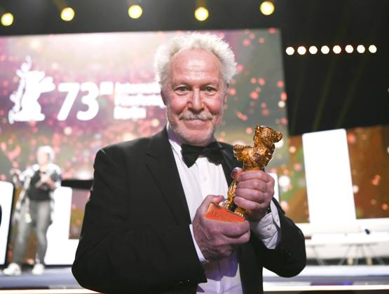 (230226) -- BERLIN, Feb. 26, 2023 -- Nicolas Philibert, director of the film On the Adamant , poses for photos after receiving the Golden Bear for Best Film during the 73rd Berlin International Film Festival in Berlin, Germany, Feb. 25, 2023. ) GERMANY-BERLIN-BERLINALE 2023-AWARDS RenxPengfei 