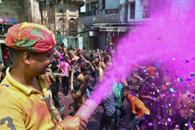March 8, 2023, Prayagraj, Uttar Pradesh, India: Prayagraj: A person spray color powders on People dancing during Holi festival Celebration in Prayagraj on Wednesday, March 08, 2023. Prayagraj India - ZUMAv115 20230308_zap_v115_011 Copyright: xPrabhatxKumarxVermax