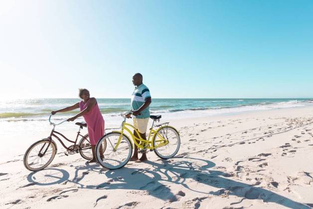 African american senior couple with bikes walking and talking at beach against clear sky in summer African american senior couple with bikes walking and talking at beach against clear sky in summer. Copy space, travel, unaltered, vacation, love, together, retirement, nature, active lifestyle., model released, , property released, Cape Town, South Africa, 19.01.2023, 3932084.jpg, people,african american,senior couple,bike,walking,talking,beach,clear,sky,summer,copy space,space travel,retired,unaltered,vacation,love,together,retirement,nature,sea,landscape,travel,outdoor,water,ocean,beautiful,tourism,blue,coast,holiday,sun,view,sand,green,natural,tropical,outdoors,sunny,day,african,american,senior,couple,copy,space Senior,Elderly,Man,Male,Bl