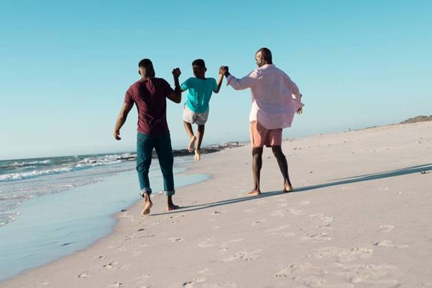 Rear view of african american father and grandfather holding boy s hands and picking him up at beach Rear view of african american father and grandfather holding boy s hands and picking him up at beach. Copy space, unaltered, multigeneration family, together, child, nature, vacation, enjoy, summer., model released, , property released, Cape Town, South Africa, 19.01.2023, 3991088.jpg, people,rear view,african american,father,grandfather,holding,boy,hand,picking,beach,copy space,unaltered,multigeneration,family,together,child,nature,vacation,sea,summer,ocean,water,travel,coast,mother,beautiful,outdoor,happy,holiday,parent,lifestyle,landscape,young,sand,daughter,son,fun,rear,view,african,american,copy,space Senior,Elderly,Man,Male,Black,Mid