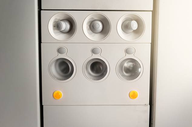 RECORD DATE NOT STATED Adjustable lights and air conditioners overhead seat controls of a commercial aircraft. Closed air conditioners nozzles , 30093284.jpg, airplane, knob, passenger cabin, control panel, air vehicle, control, technology, flying, push button, no people, travel, airplane seat, seat, transportation, sign, symbol, design, safety, equipment, commercial airplane, passenger, airplane interior, airline, ceiling, aeroplane, console, ventilation, conditioning, conditioner, board, fly, aircraft, panel, button, interior, cabin, flight, overhead, plane, nozzles, closed, round, adjustable, icon, light, transport, seating, nobody, security, plastic,