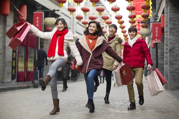 Happy young Chinese friends shopping for Chinese New Year Beijing China Copyright: xLianxFeix bji05210163
