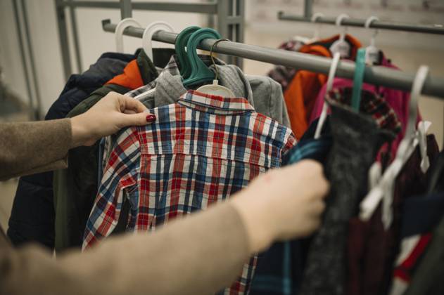 Hands of woman choosing clothes at store model released, Symbolfoto property released, ANAF01160