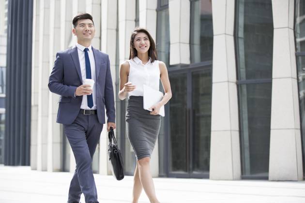 Confident Chinese business people walking outdoors Beijing China Copyright: xLianxFeix bji04970189