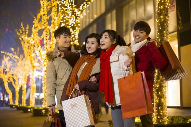 Happy young Chinese friends shopping for Chinese New Year Beijing China Copyright: xLianxFeix bji05210209