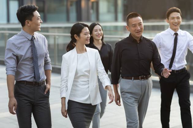 Confident Chinese business people walking outdoors Beijing China Copyright: xLanexOateyx bji06520173