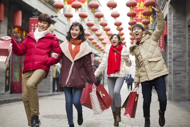 Happy young Chinese friends shopping for Chinese New Year Beijing China Copyright: xLianxFeix bji05210158