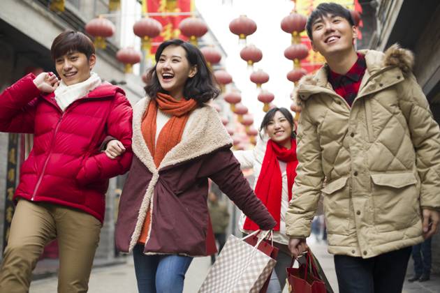 Happy young Chinese friends shopping for Chinese New Year Beijing China Copyright: xLianxFeix bji05210159