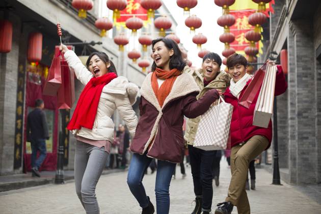 Happy young Chinese friends shopping for Chinese New Year Beijing China Copyright: xLianxFeix bji05210160