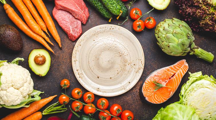 Assorted food raw products: vegetables, beef meat, fish salmon and empty plate in centre, dark rustic brown stone table top view copy space. Healthy food concept, ingredients for balanced diet Assorted food raw products: vegetables, beef meat, fish salmon and empty plate in centre, dark rustic brown stone table top view copy space. Healthy food background, ingredients for balanced diet Copyright: xZoonar.com OlenaxYeromenkox 20054226