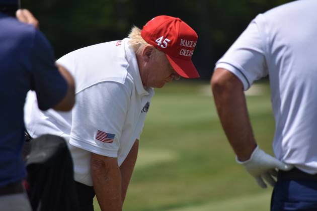 May 27, 2023, Sterling, Virginia, United States: Former President of the United States Donald J. Trump swings his put and golfs at the driving range. Former President of the United States Donald J. Trump visits the driving range, meets fans and watches LIV Golf Washington DC 2023 Round 2 at Trump National Golf Club Washington DC in Sterling, Virginia, United States. Sterling United States - ZUMAs197 20230527_zaa_s197_131 Copyright: xKylexMazzax