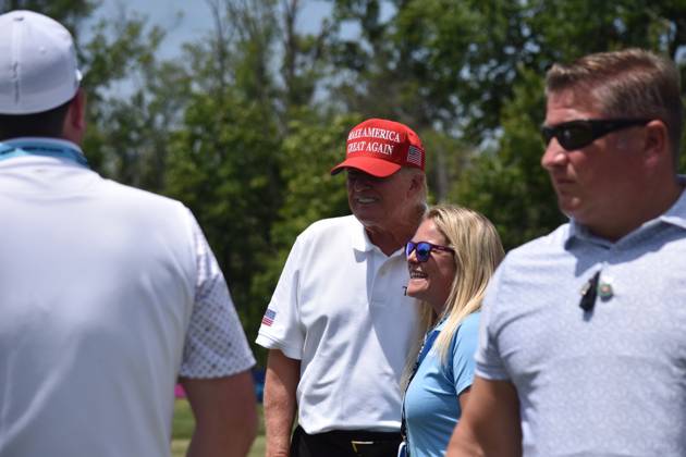 May 27, 2023, Sterling, Virginia, United States: Former President of the United States Donald J. Trump takes photos, signs objects as he visits the driving range. Former President of the United States Donald J. Trump visits the driving range, meets fans and watches LIV Golf Washington DC 2023 Round 2 at Trump National Golf Club Washington DC in Sterling, Virginia, United States. Sterling United States - ZUMAs197 20230527_zaa_s197_141 Copyright: xKylexMazzax