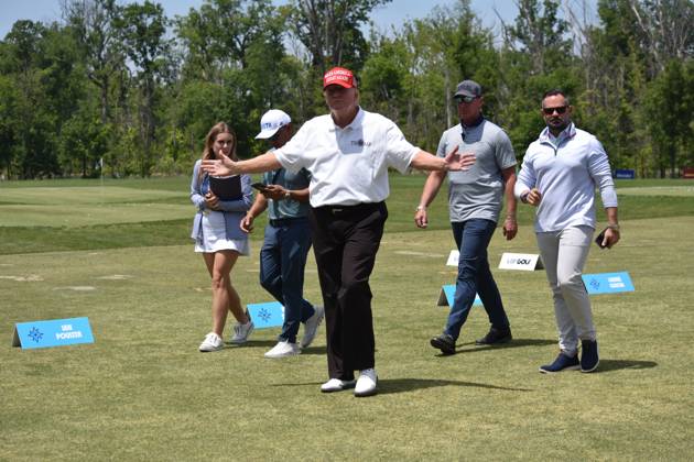May 27, 2023, Sterling, Virginia, United States: Former President of the United States Donald J. Trump walks by fans and talks with them. Former President of the United States Donald J. Trump visits the driving range, meets fans and watches LIV Golf Washington DC 2023 Round 2 at Trump National Golf Club Washington DC in Sterling, Virginia, United States. Sterling United States - ZUMAs197 20230527_zaa_s197_144 Copyright: xKylexMazzax