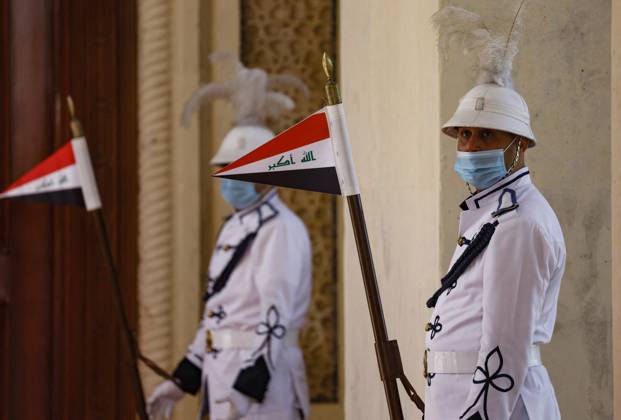 French President Emmanuel Macron in Baghdad - Iraq Iraqi honour guard hold national flags during an official welcoming ceremony for French President Emmanuel Macron in Baghdad on August 28, 2021. - Macron is among leaders set to attend a regional summit today in Iraq, with the Taliban s takeover of Afghanistan and a deadly jihadist attack in Kabul overshadowing the meeting. Photo by Ludovic Marin pool ABACAPRESS;COM Baghdad Iraq Copyright: xMarinxLudovic Pool ABACAx 778085_005 MarinxLudovic Pool ABACAx 778085_005