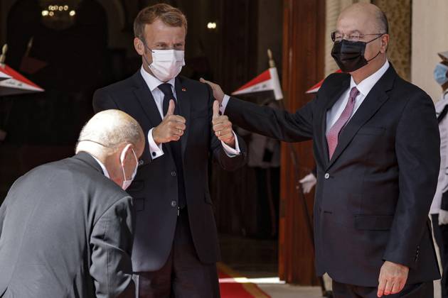 French President Emmanuel Macron in Baghdad - Iraq Iraqi President Barham Saleh (R) welcomes his French counterpart Emmanuel Macron (C) in Baghdad on August 28, 2021. - Macron is among leaders set to attend a regional summit today in Iraq, with the Taliban s takeover of Afghanistan and a deadly jihadist attack in Kabul overshadowing the meeting. Photo by Ludovic Marin pool ABACAPRESS;COM Baghdad Iraq Copyright: xMarinxLudovic Pool ABACAx 778085_010 MarinxLudovic Pool ABACAx 778085_010