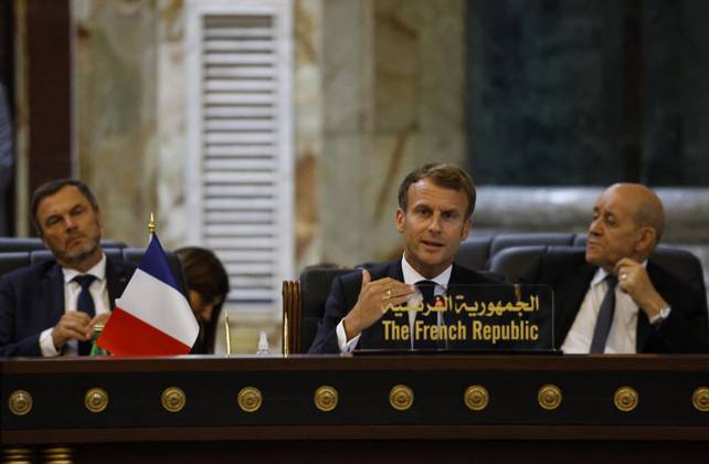 French President Emmanuel Macron in Baghdad - Iraq French President Emmanuel Macron speaks (C), accompanied by French Foreign Affairs Minister Jean-Yves Le Drian (R), during the Baghdad conference in the Iraqi capital on August 28, 2021. (Photo by Ludovic MARIN POOL ABACAPRESS.COM Baghdad Iraq Copyright: xMarinxLudovic Pool ABACAx 778120_031 MarinxLudovic Pool ABACAx 778120_031