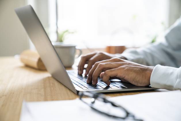 Hands of freelancer typing on laptop at home model released, Symbolfoto property released, VPIF08160
