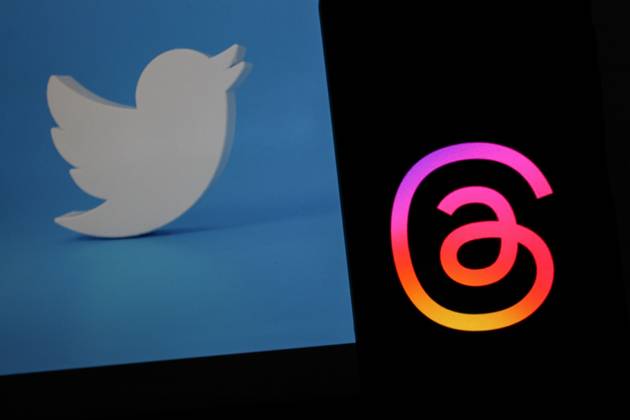 July 7, 2023, Bandung, West Java, Indonesia: In this photo illustration, Threads logo seen displayed on a smartphone and a Twitter logo in the background. Threads is the new social network from Meta Platforms which was launched on the 5th of July 2023. According to Meta CEO Mark Zuckerberg, the Threads app is designed to rival Twitter. As of 6th of July 2023, the Thread app already has 10 million users. Bandung Indonesia - ZUMAs281 20230707_zip_s281_001 Copyright: xAlgixFebrixSugitax
