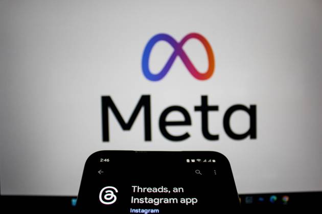 July 7, 2023, Bandung, West Java, Indonesia: In this photo illustration, Threads logo seen displayed on a smartphone and a Meta logo in the background. Threads is the new social network from Meta Platforms which was launched on the 5th of July 2023. According to Meta CEO Mark Zuckerberg, the Threads app is designed to rival Twitter. As of 6th of July 2023, the Thread app already has 10 million users. Bandung Indonesia - ZUMAs281 20230707_zip_s281_002 Copyright: xAlgixFebrixSugitax