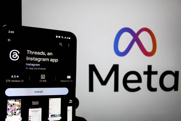 July 7, 2023, Bandung, West Java, Indonesia: In this photo illustration, Threads logo seen displayed on a smartphone and a Meta logo in the background. Threads is the new social network from Meta Platforms which was launched on the 5th of July 2023. According to Meta CEO Mark Zuckerberg, the Threads app is designed to rival Twitter. As of 6th of July 2023, the Thread app already has 10 million users. Bandung Indonesia - ZUMAs281 20230707_zip_s281_004 Copyright: xAlgixFebrixSugitax