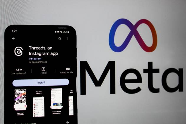 July 7, 2023, Bandung, West Java, Indonesia: In this photo illustration, Threads logo seen displayed on a smartphone and a Meta logo in the background. Threads is the new social network from Meta Platforms which was launched on the 5th of July 2023. According to Meta CEO Mark Zuckerberg, the Threads app is designed to rival Twitter. As of 6th of July 2023, the Thread app already has 10 million users. Bandung Indonesia - ZUMAs281 20230707_zip_s281_008 Copyright: xAlgixFebrixSugitax